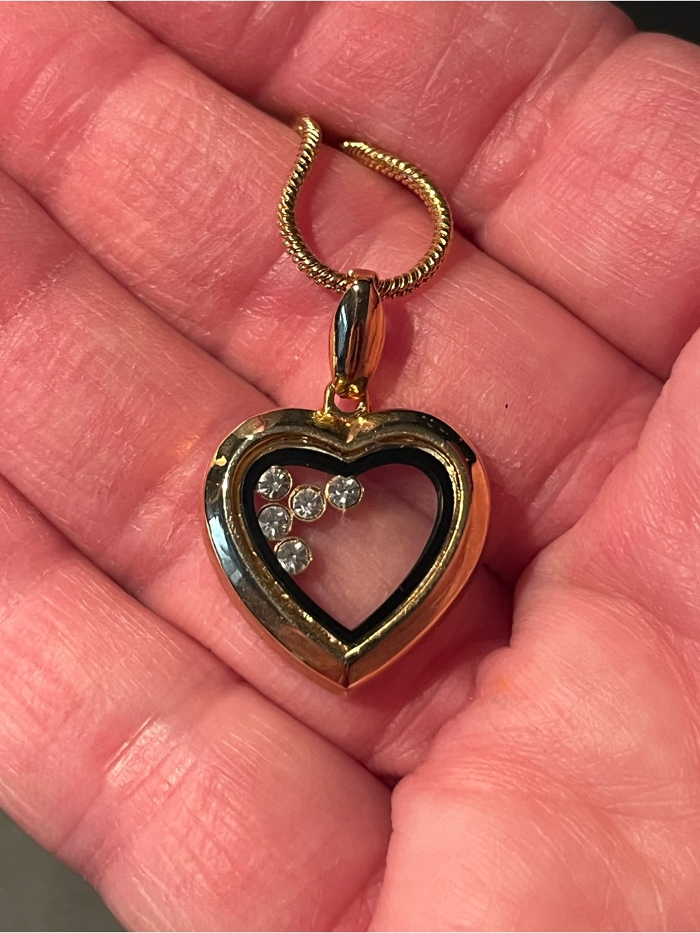 Fabulous gold tone heart pendant with 16” chain. Heart has 5 shiny stones inside